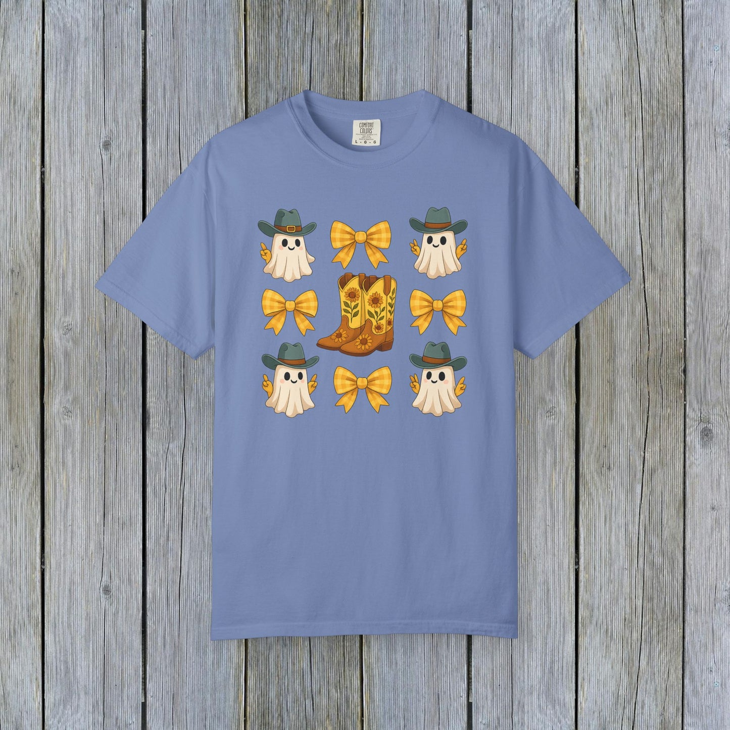 Cute Halloween T-Shirt showcasing a playful design with ghosts and cowboy boots. Ideal for unisex fall fashion and crafted from eco-friendly materials.