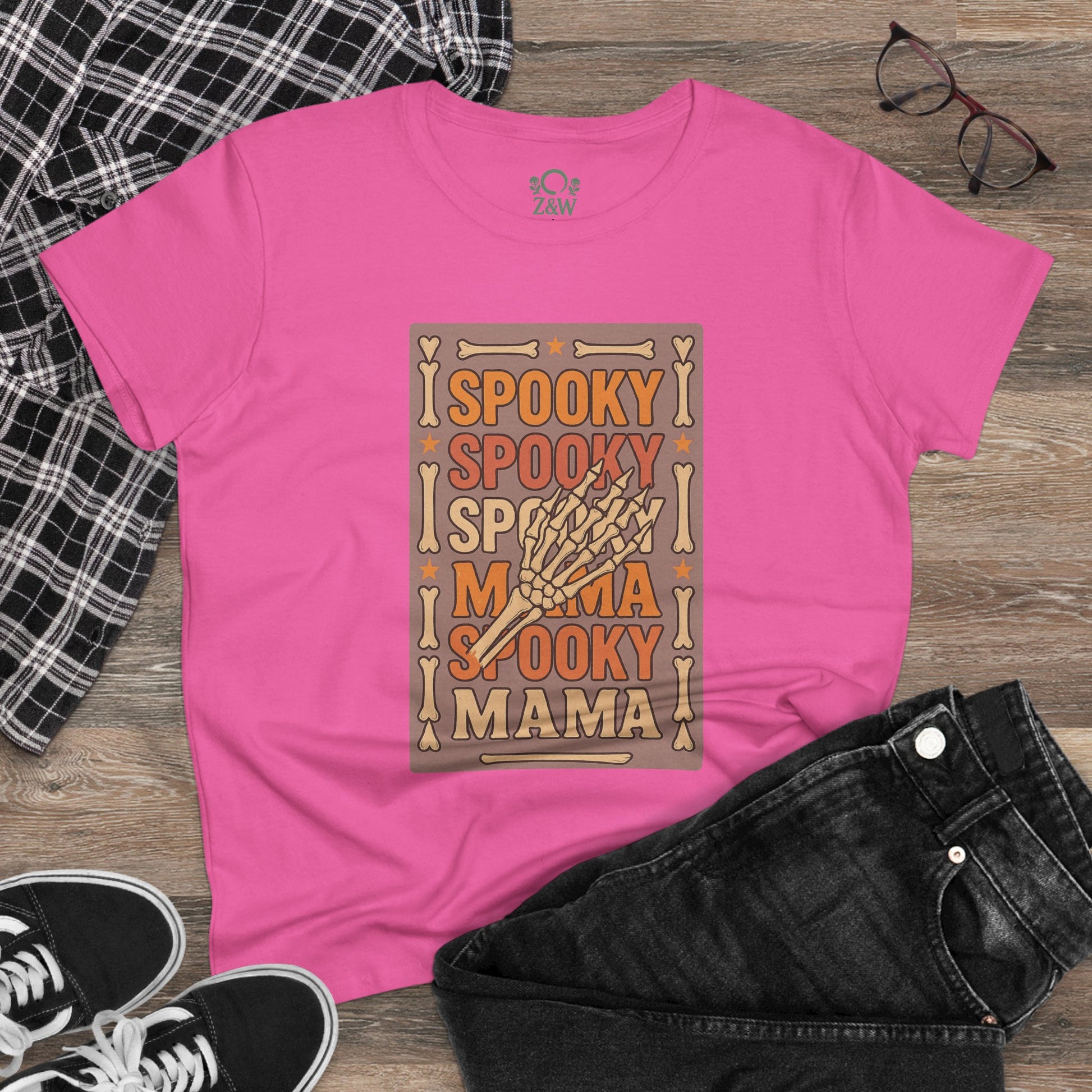 Stylish outfit display with the Spooky Mama Tee in pink, paired with black jeans and sneakers, highlighting its versatile wear for any casual outing.