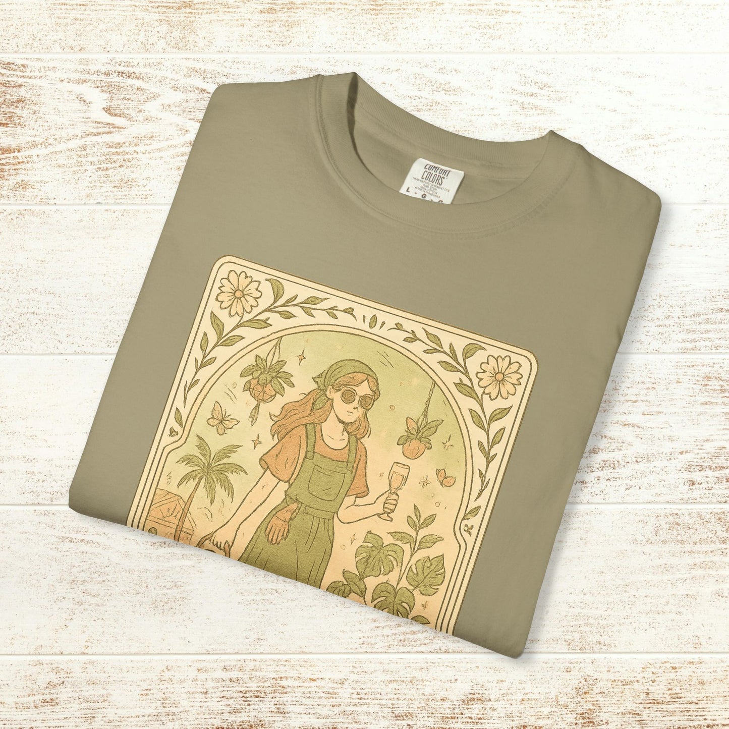Flat-lay view of the Rooted One Tarot Tee in peaceful olive green, displaying a detailed illustration of a nature-loving woman. Ethically sourced cotton, available in sizes S to 4XL.