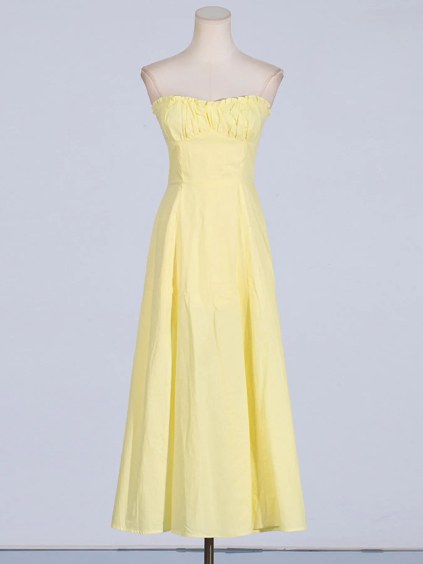 Elegant Trendy Slit Sleeveless Midi Dress with Zip Back in yellow shown from a stylish front angle, showcasing its flowing skirt and modal design.