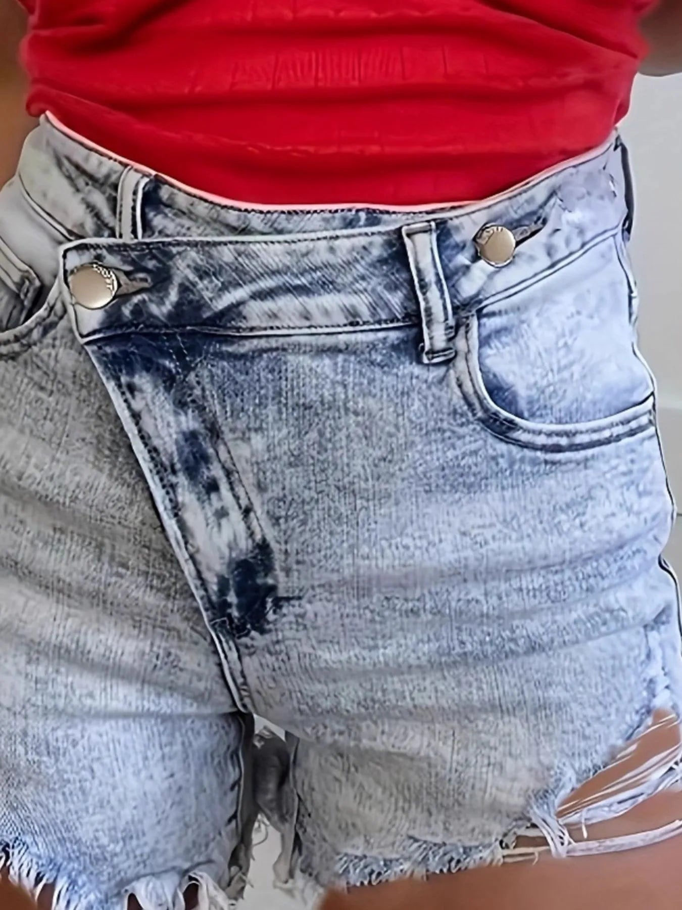Close-up of High Waisted Distressed Denim Shorts for Women, Slightly Stretchy with Frayed Hem highlighting the unique design and trendy look.