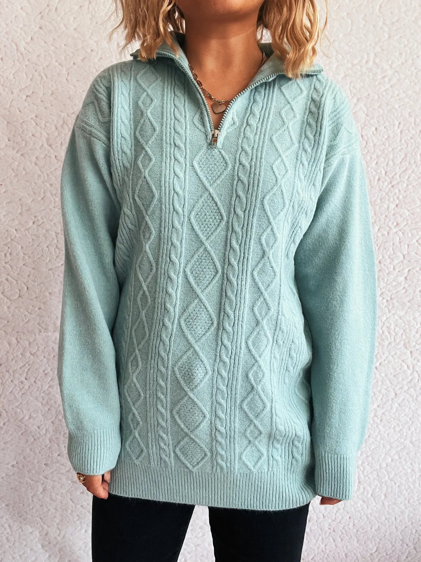 Model showcasing the front of the Cozy Cable-Knit Texture Zip Collar Long Sleeve Sweater with a focus on the textured cable-knit pattern and relaxed fit.