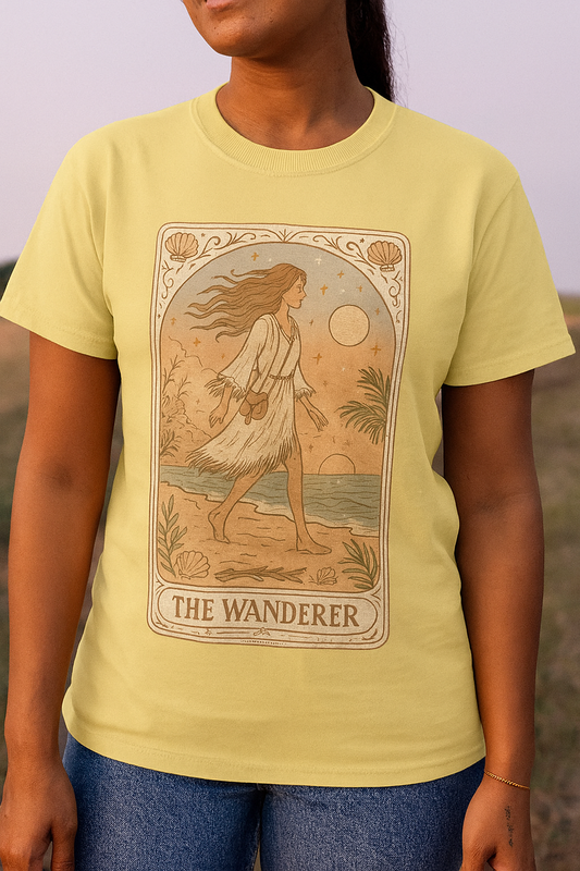 Wanderer Tarot Graphic Tee featuring a beautiful illustration of a wanderer by the beach, designed for comfort and style. Made from 100% ethically sourced cotton, available in sizes S to 4XL, perfect for unique fashion lovers.