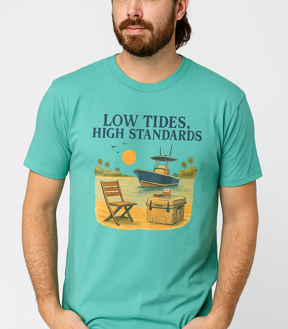 Man wearing a Garment-Dyed Low Tides High Standards T-Shirt in turquoise, featuring a boat and beach chair design, perfect for a relaxed summer vibe.