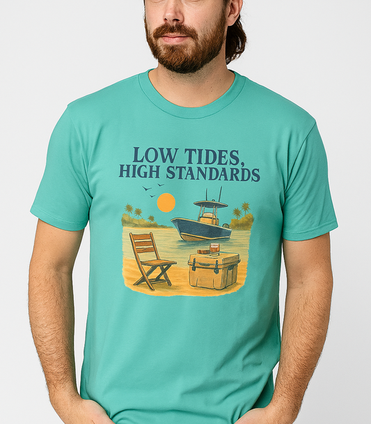 Man wearing a Garment-Dyed Low Tides High Standards T-Shirt in turquoise, featuring a boat and beach chair design, perfect for a relaxed summer vibe.
