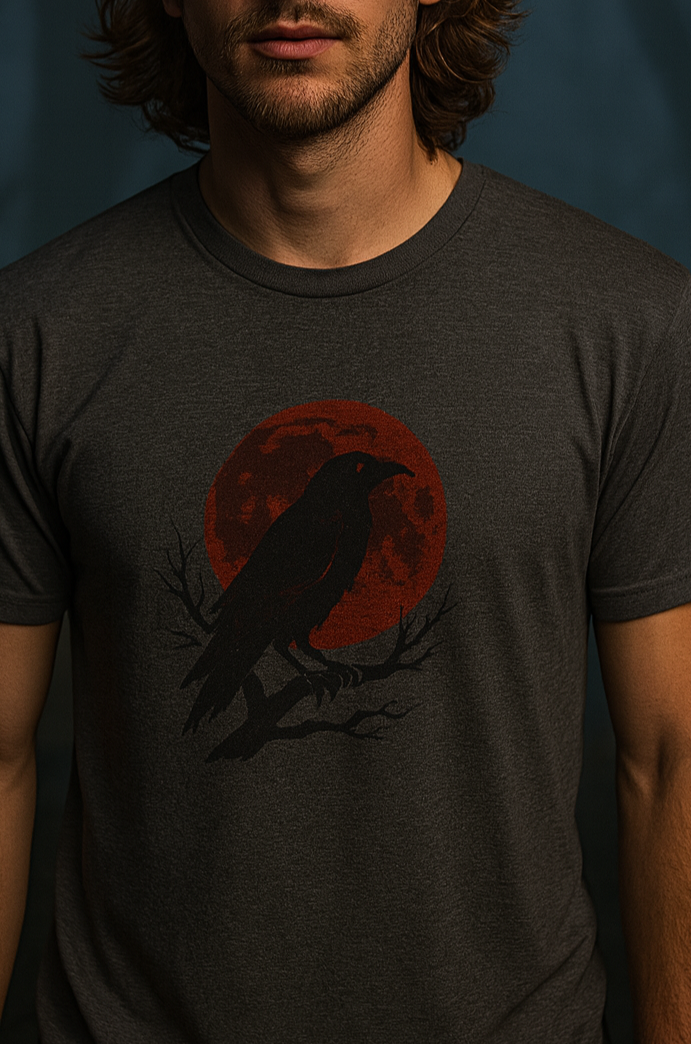 Gothic Raven T-Shirt - Heavy Cotton Tee featuring a black raven perched on a branch against a red full moon, perfect for Halloween and unique spooky gifts.