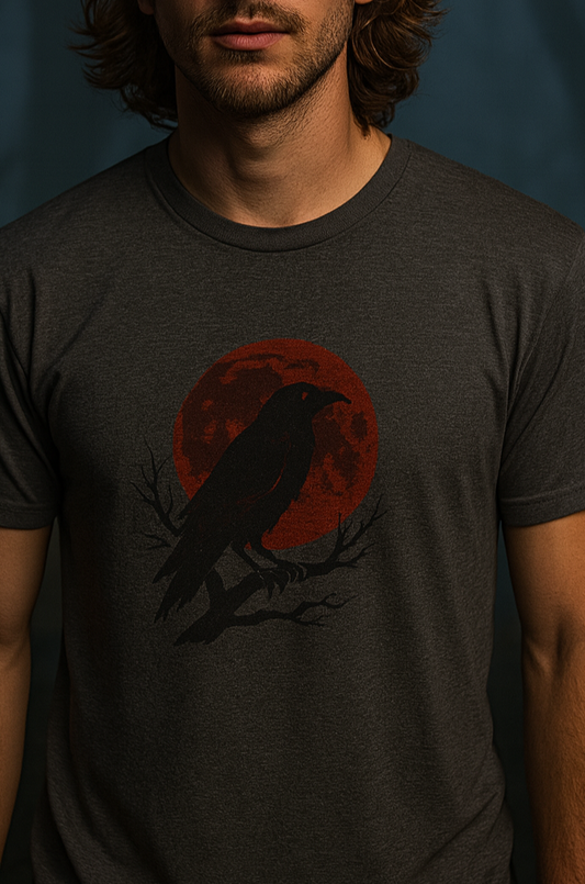 Gothic Raven T-Shirt - Heavy Cotton Tee featuring a black raven perched on a branch against a red full moon, perfect for Halloween and unique spooky gifts.