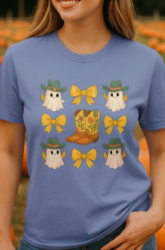 Cute Halloween T-Shirt featuring whimsical ghosts wearing cowboy hats and bows, alongside a decorative cowboy boot, perfect for fall fashion in eco-friendly fabric.