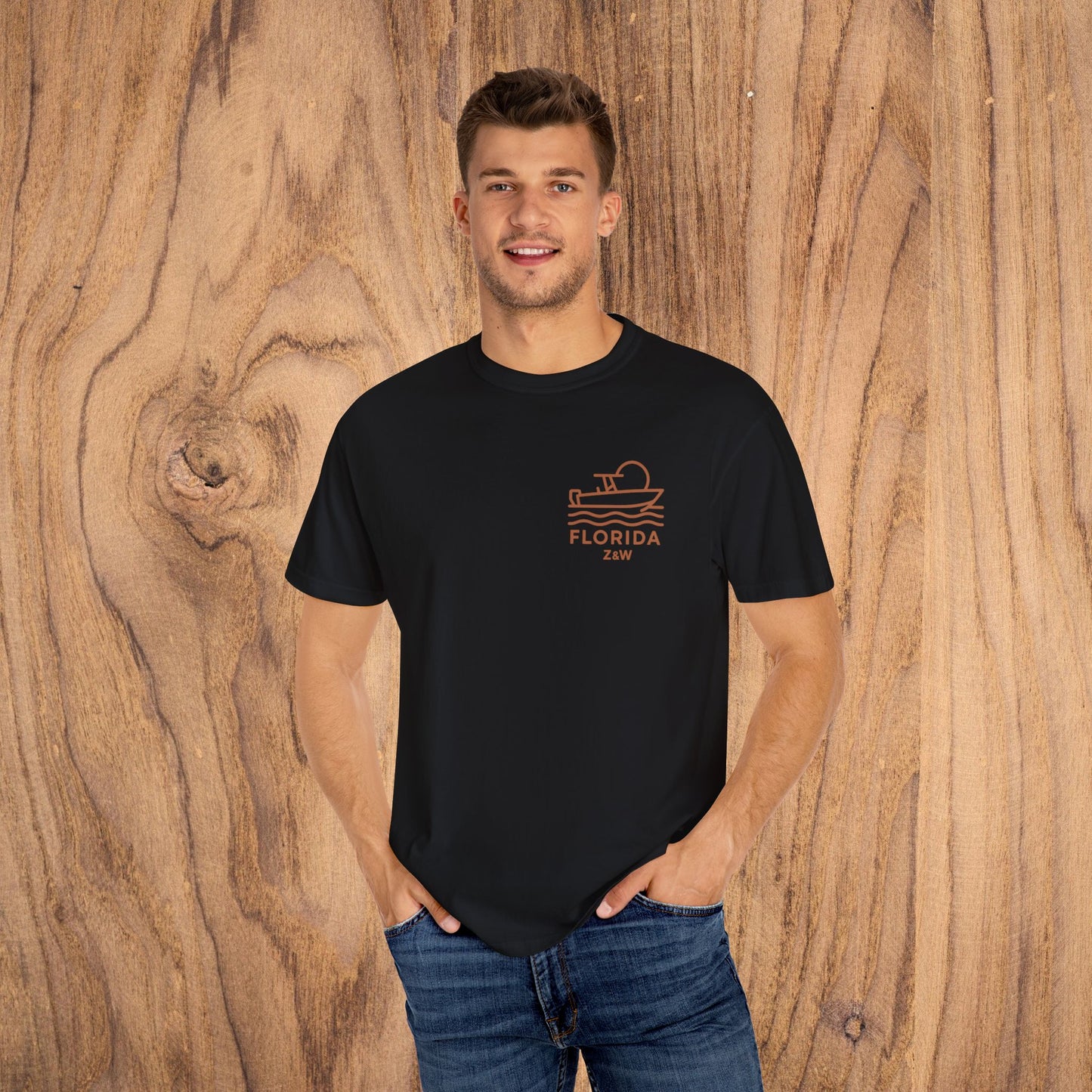 Model displaying the Unisex Florida Graphic Tee in black, featuring a trendy boating design. This versatile tee is made of soft US cotton and is available in a range of sizes from S-4XL, perfect for casual outings.