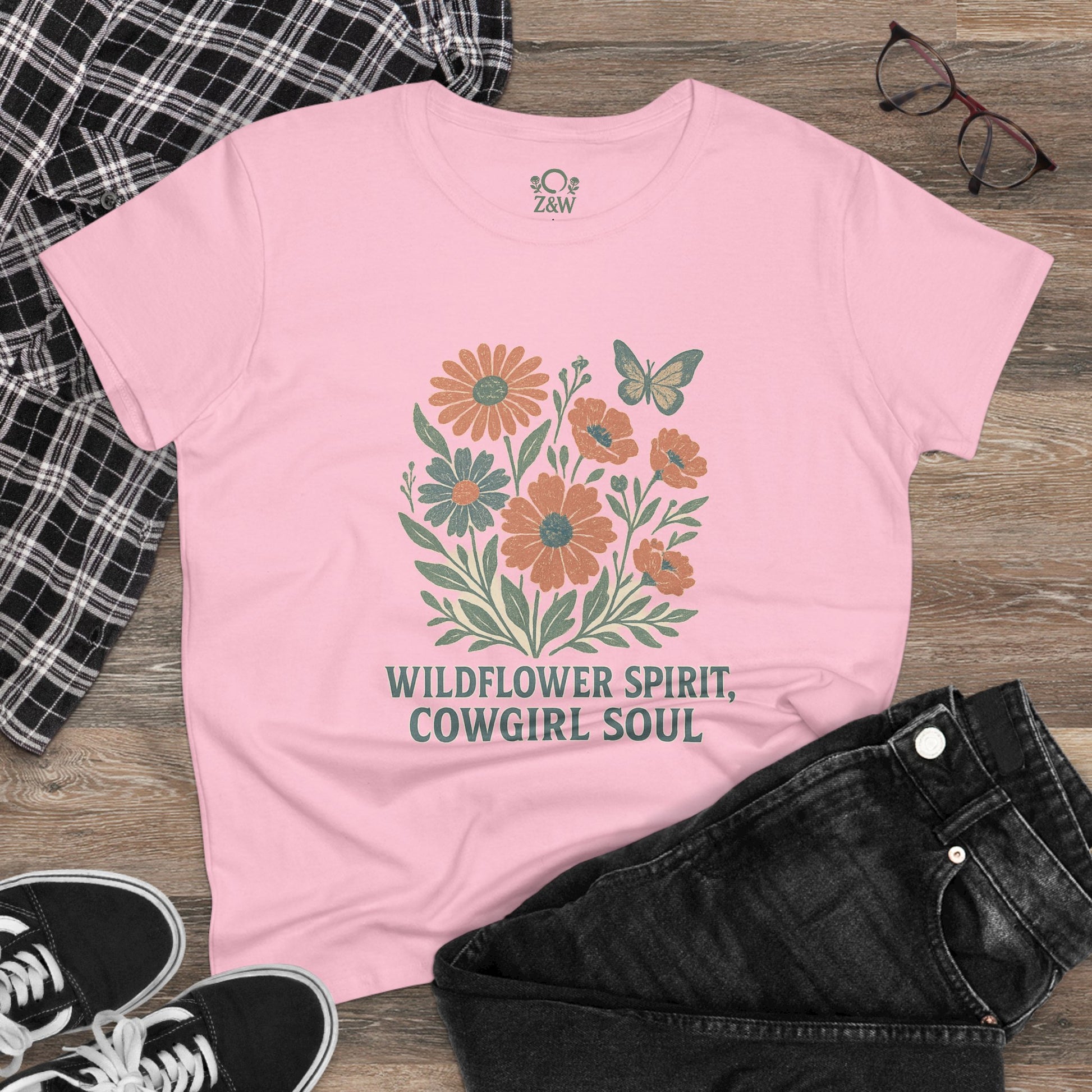 Wildflower Spirit Cotton Tee in soft pastel pink, highlighting a floral design and the saying 'Wildflower Spirit, Cowgirl Soul', perfect for a relaxed and trendy vibe.