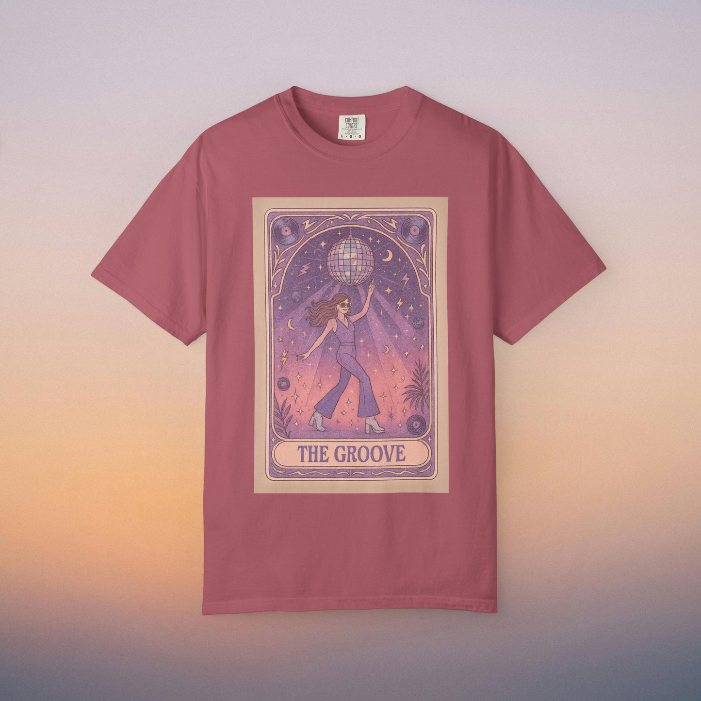 Groove Tarot Graphic Tee in coral displaying a stylish graphic of a woman with a disco ball, made of breathable cotton for comfort - available in sizes S-4XL.
