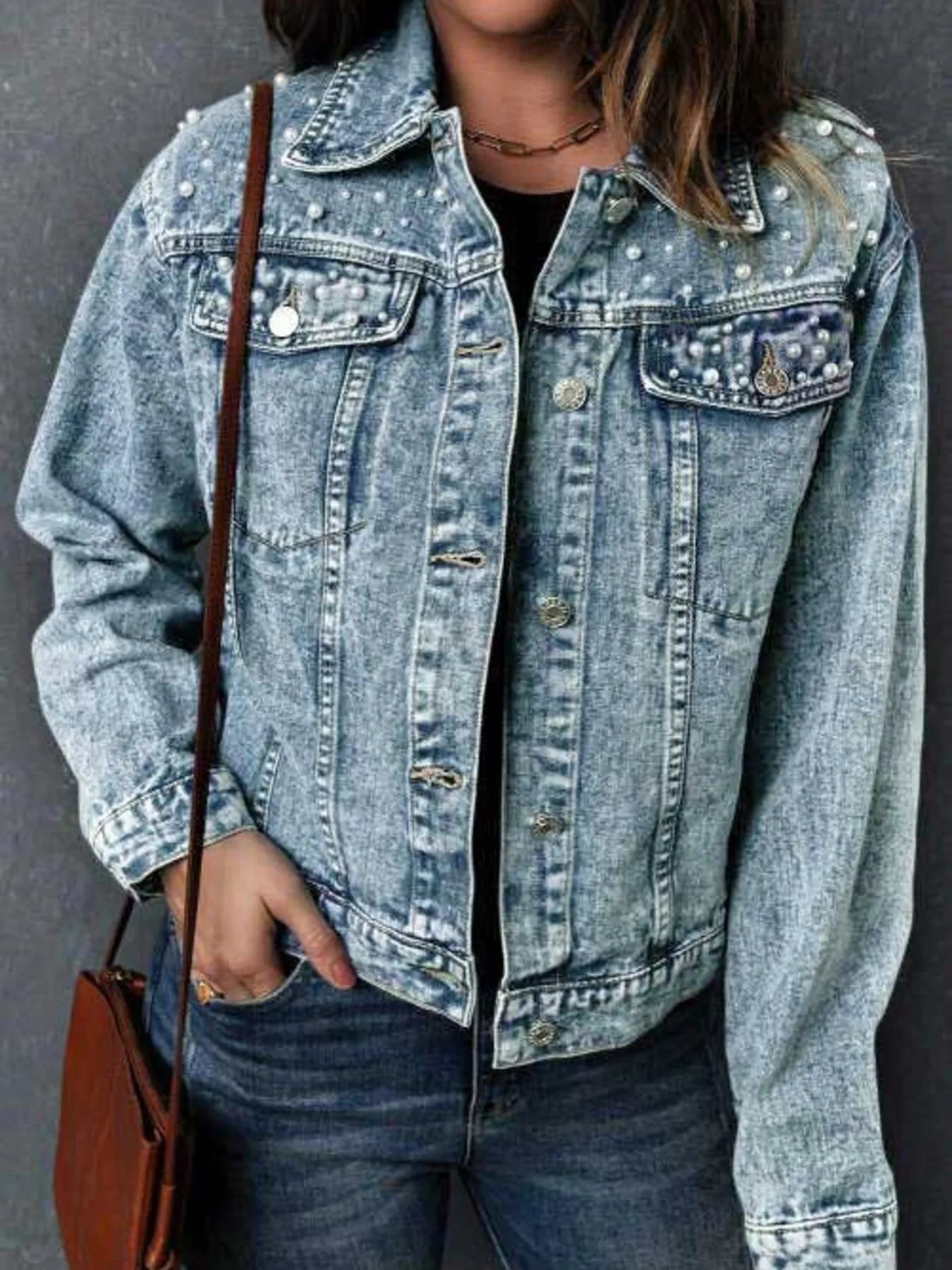 Detailed front view of the Plus Size Denim Jacket with Pearl Detail and Button Up Closure, featuring a classic look and trendy pocketed design.