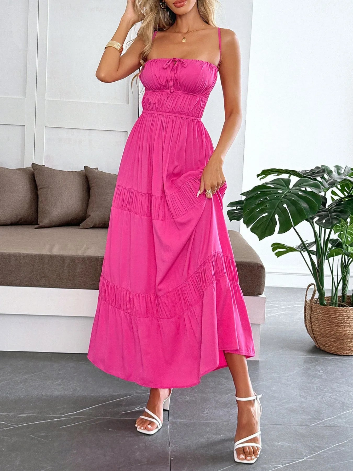 Elegant presentation of the Tied Back Tiered Maxi Cami Dress in bright pink, with a flattering silhouette, perfect for warm-weather occasions.