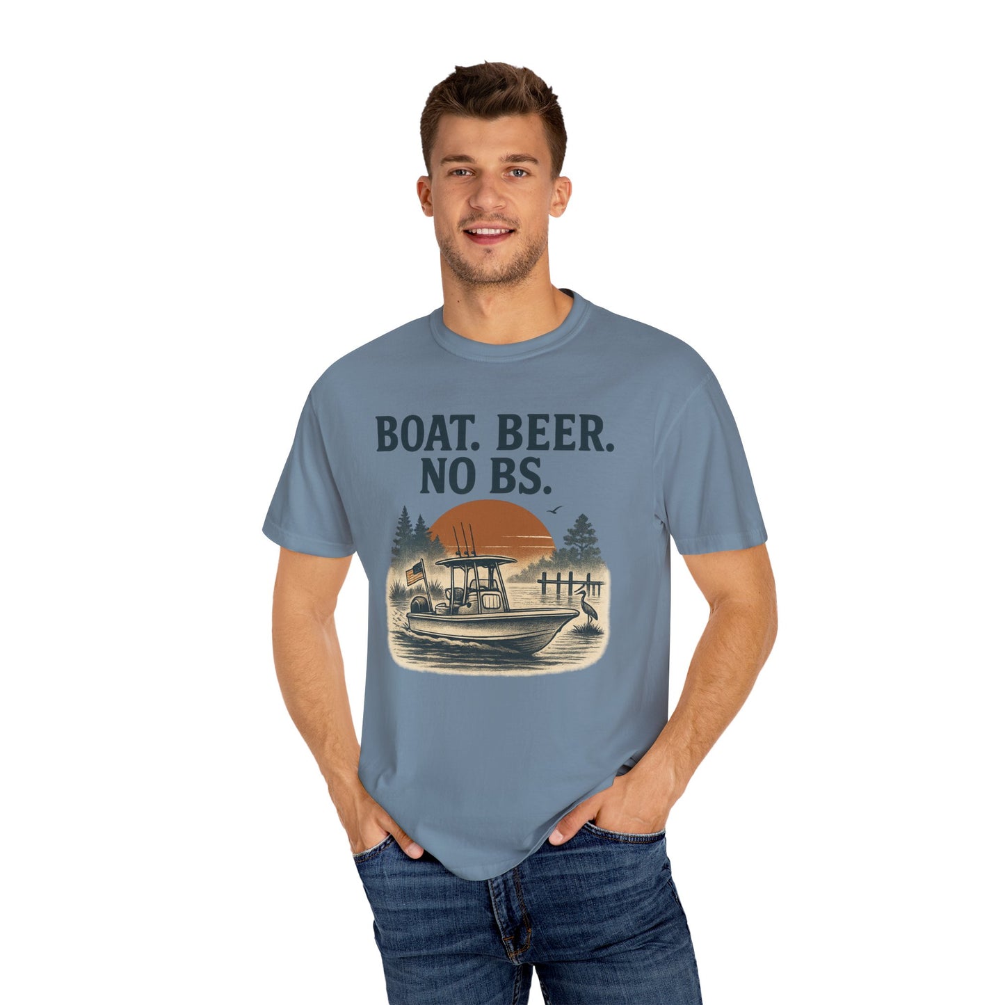 Cheerful man in Boat Beer No BS Tee in blue, captured in a natural outdoor setting, displaying a sunset and fishing theme for the boating enthusiast.