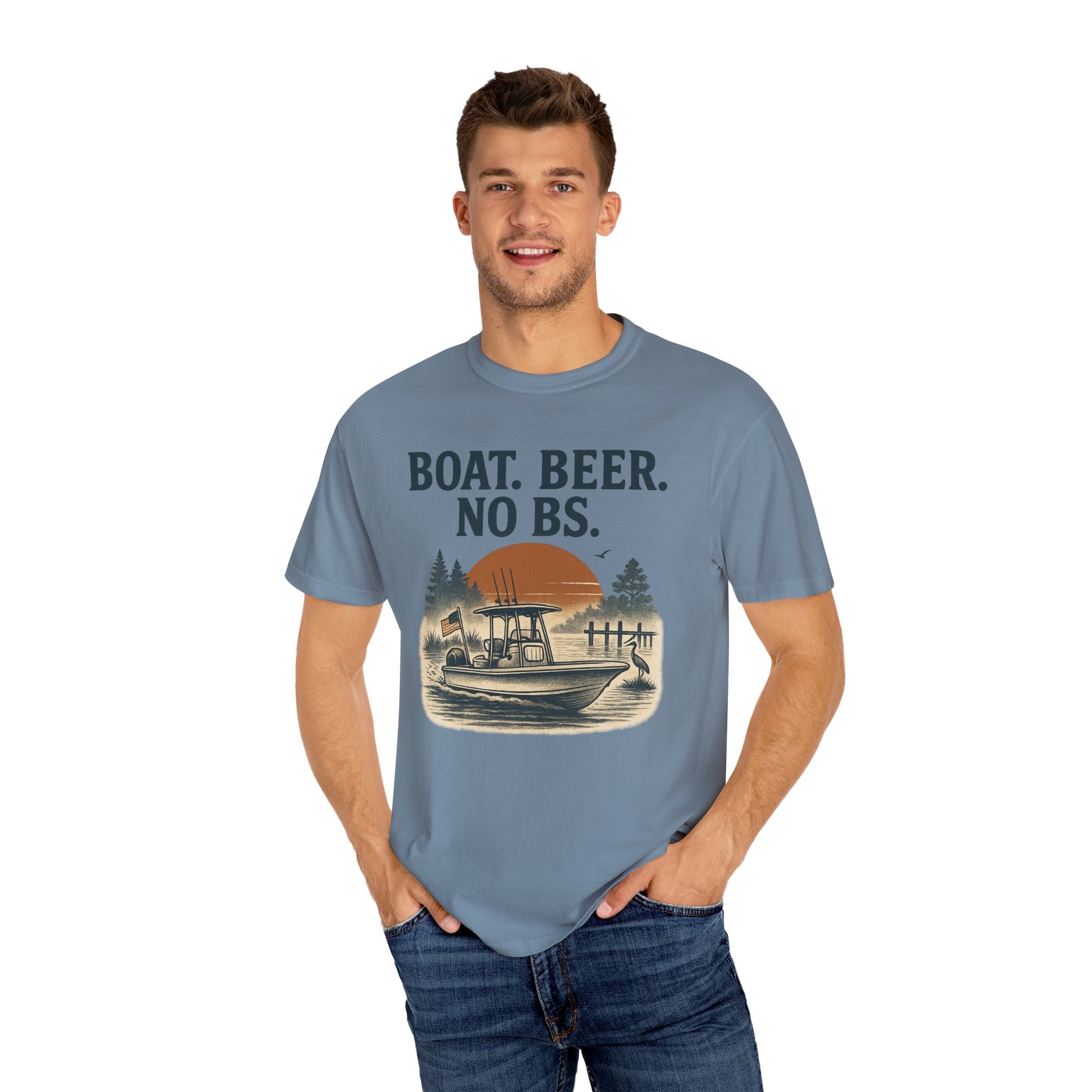 Cheerful man in Boat Beer No BS Tee in blue, captured in a natural outdoor setting, displaying a sunset and fishing theme for the boating enthusiast.