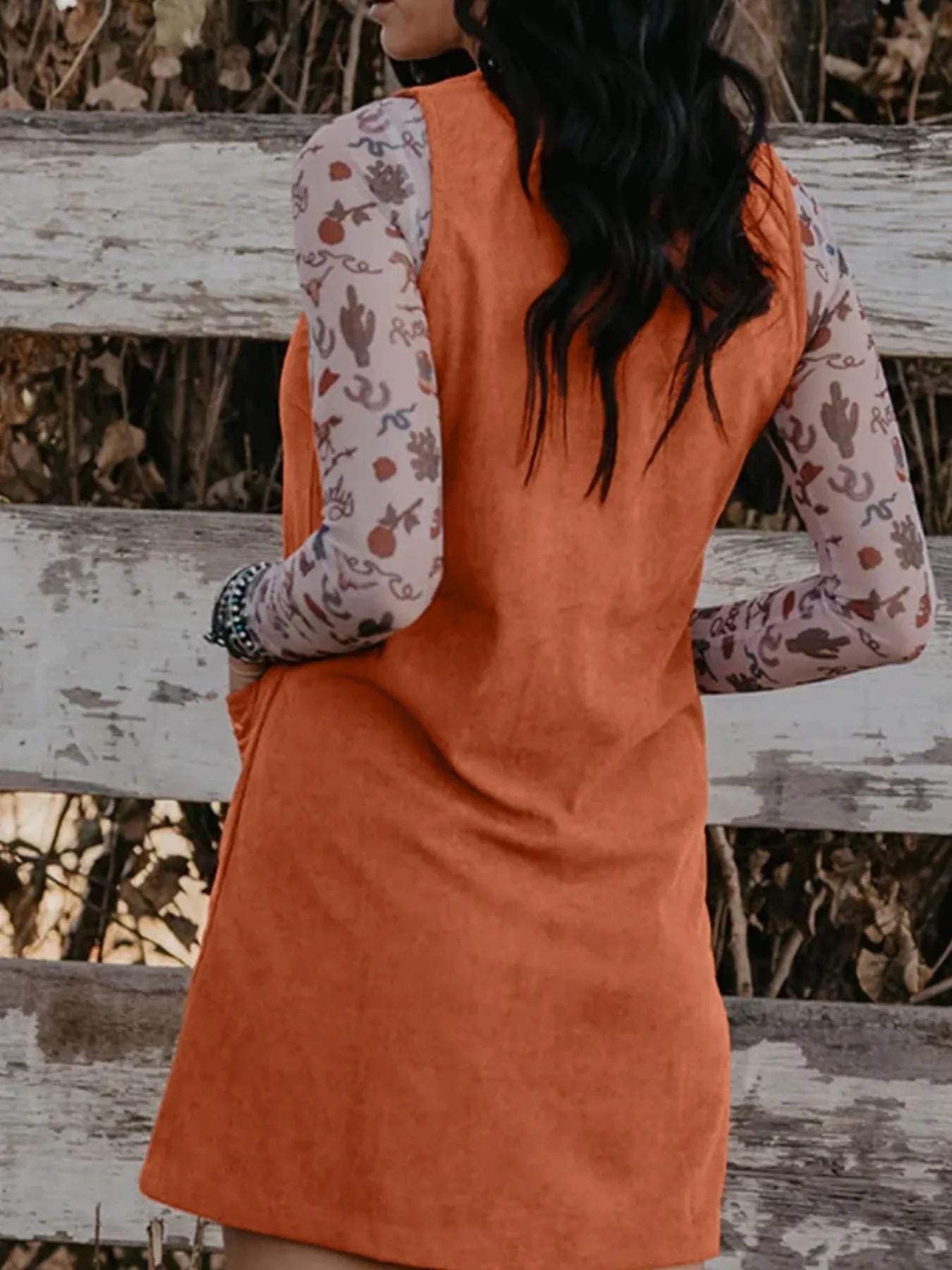 Back view of the Corduroy Western Mini Dress With Embroidered Patch Pocket, highlighting the simple yet stylish design.