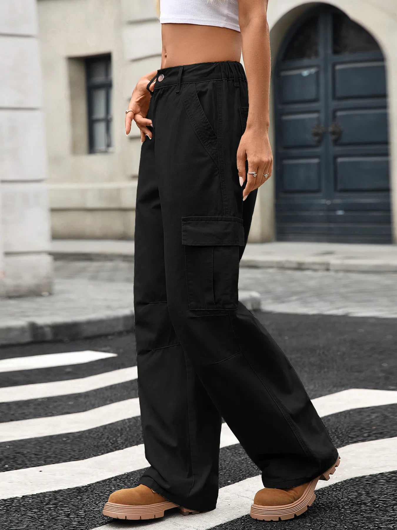 Chic Wide Leg Cargo Jeans in black, showcasing pockets and an effortlessly casual look, suitable for everyday wear.