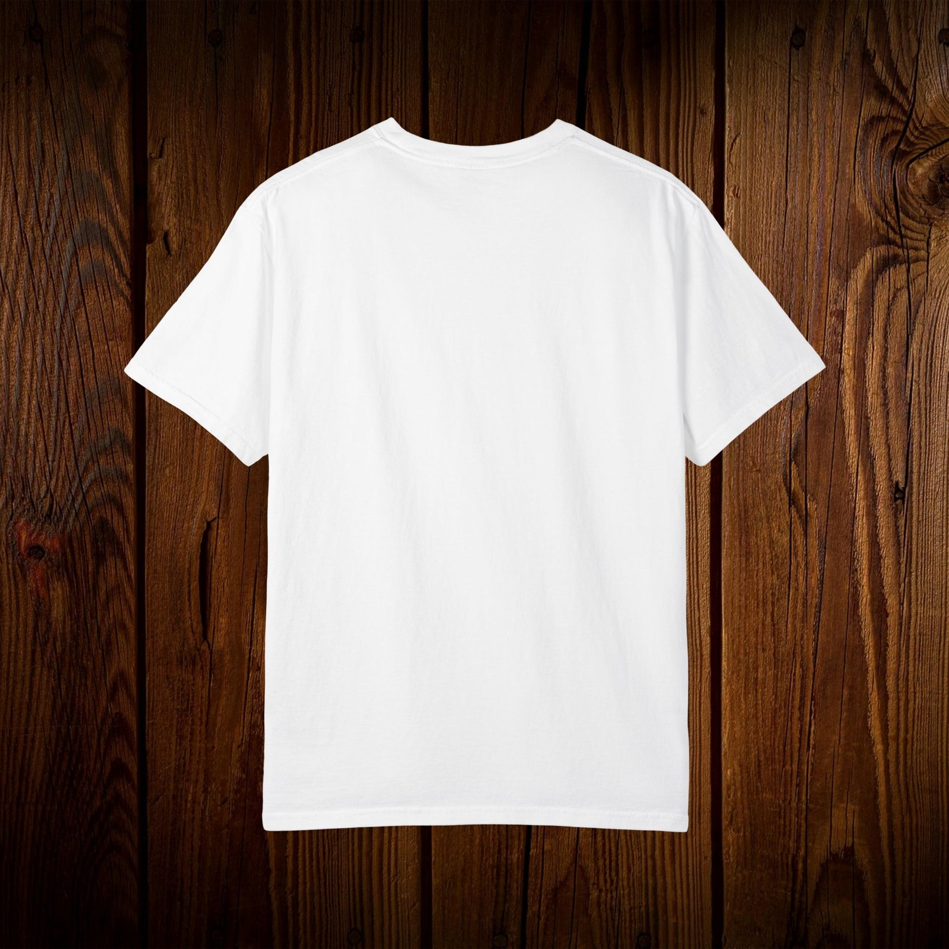 Back view of the Unisex Swamp-Bred Fairway-Fed Tee displayed against a rustic wooden background, emphasizing its simple design and quality craftsmanship.