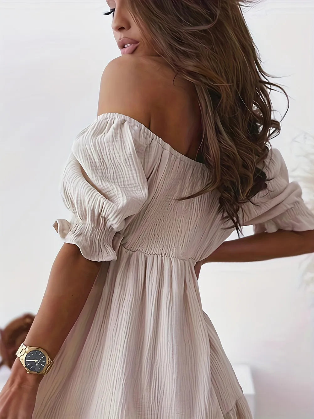 Stylish full size ruffled off-shoulder dress with short sleeves, showcasing a fashionable back design, perfect for chic outings.