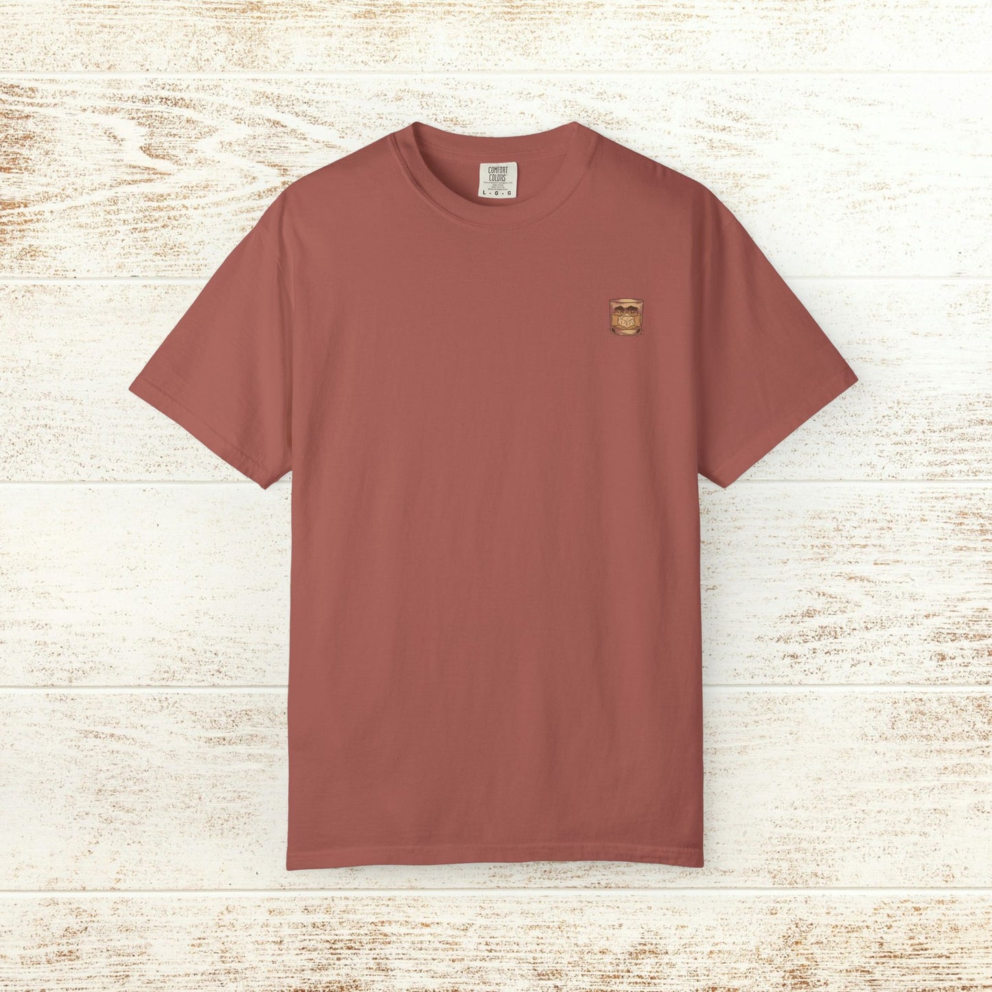 Rodeo On The Rocks Tee in terracotta color, showcasing a durable design made from 100% US cotton. Perfect for comfort and style, available in sizes S to 4XL.