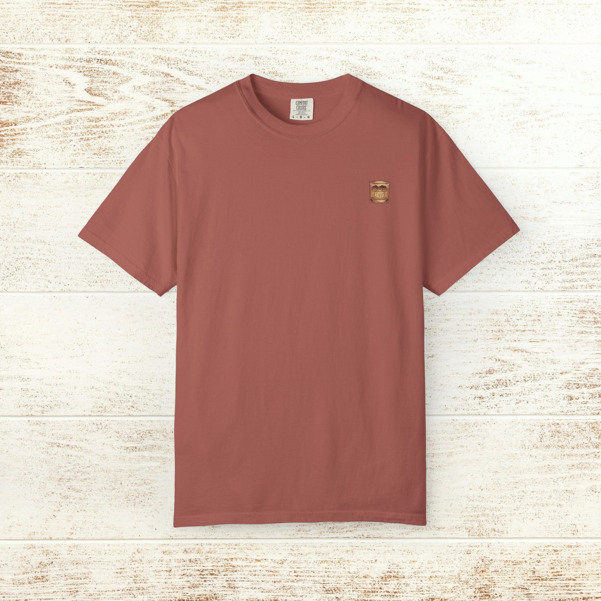 Rodeo On The Rocks Tee in terracotta color, showcasing a durable design made from 100% US cotton. Perfect for comfort and style, available in sizes S to 4XL.