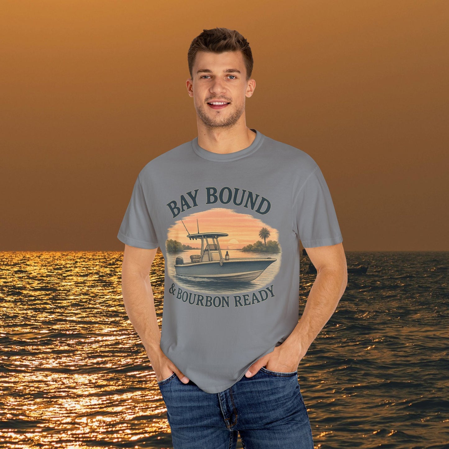 Model wearing the Bay Bound Boating T-Shirt with a sunset boat graphic, perfect for summer outings at the beach or fishing.