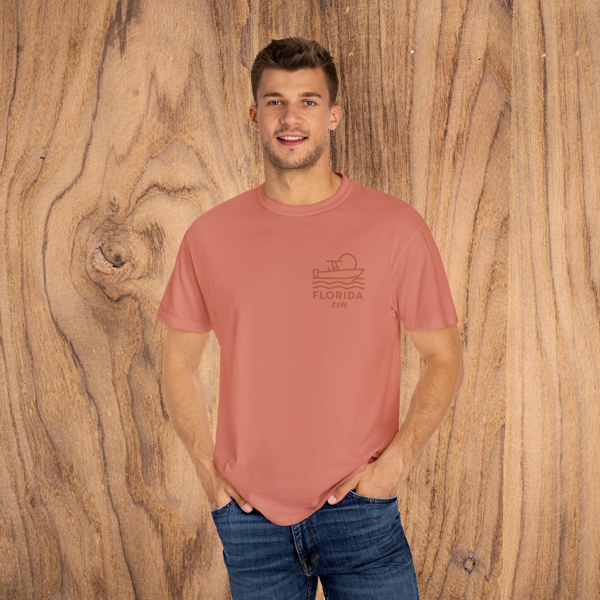 Unisex Florida Graphic Tee in a soft coral color, modeled by a man for a comfortable casual look.
