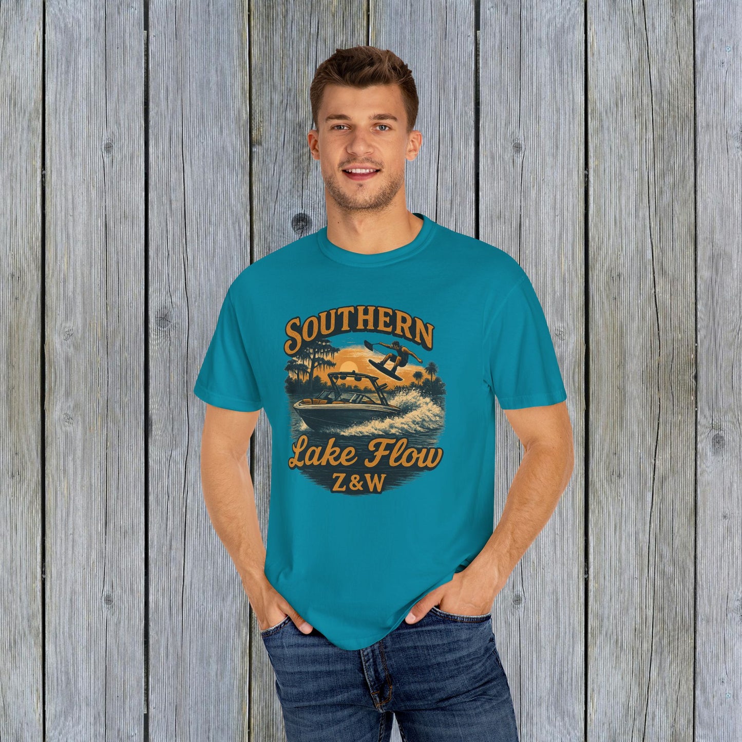 Southern Lake Flow T-Shirt worn by a man in bright blue, made from 100% US cotton, showcasing a stylish and eco-friendly casual design.