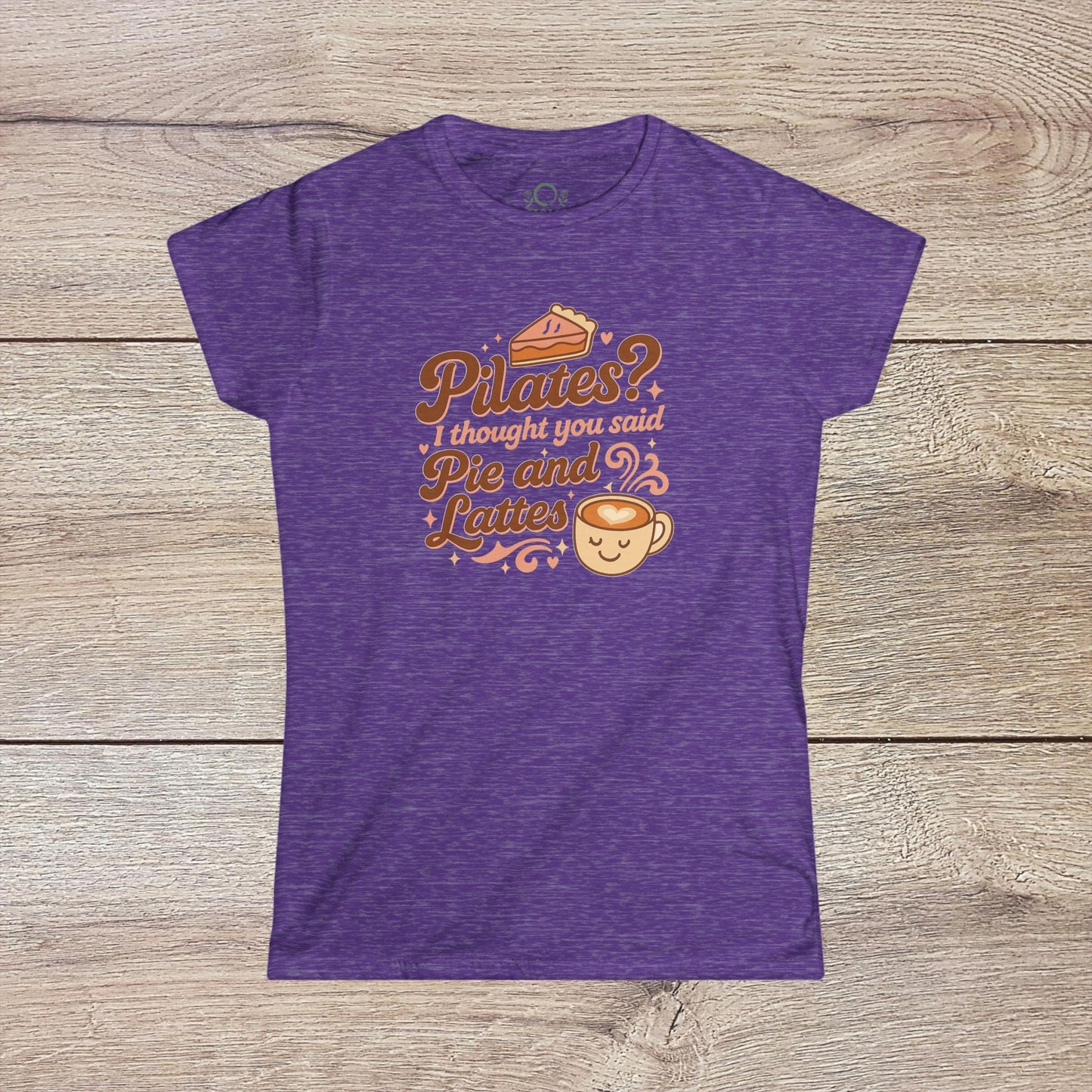 Vibrant purple Funny Pilates T-Shirt showcasing the phrase: 'Pilates? I thought you said Pie and Lattes'. Designed for comfort with durable shoulder tape.
