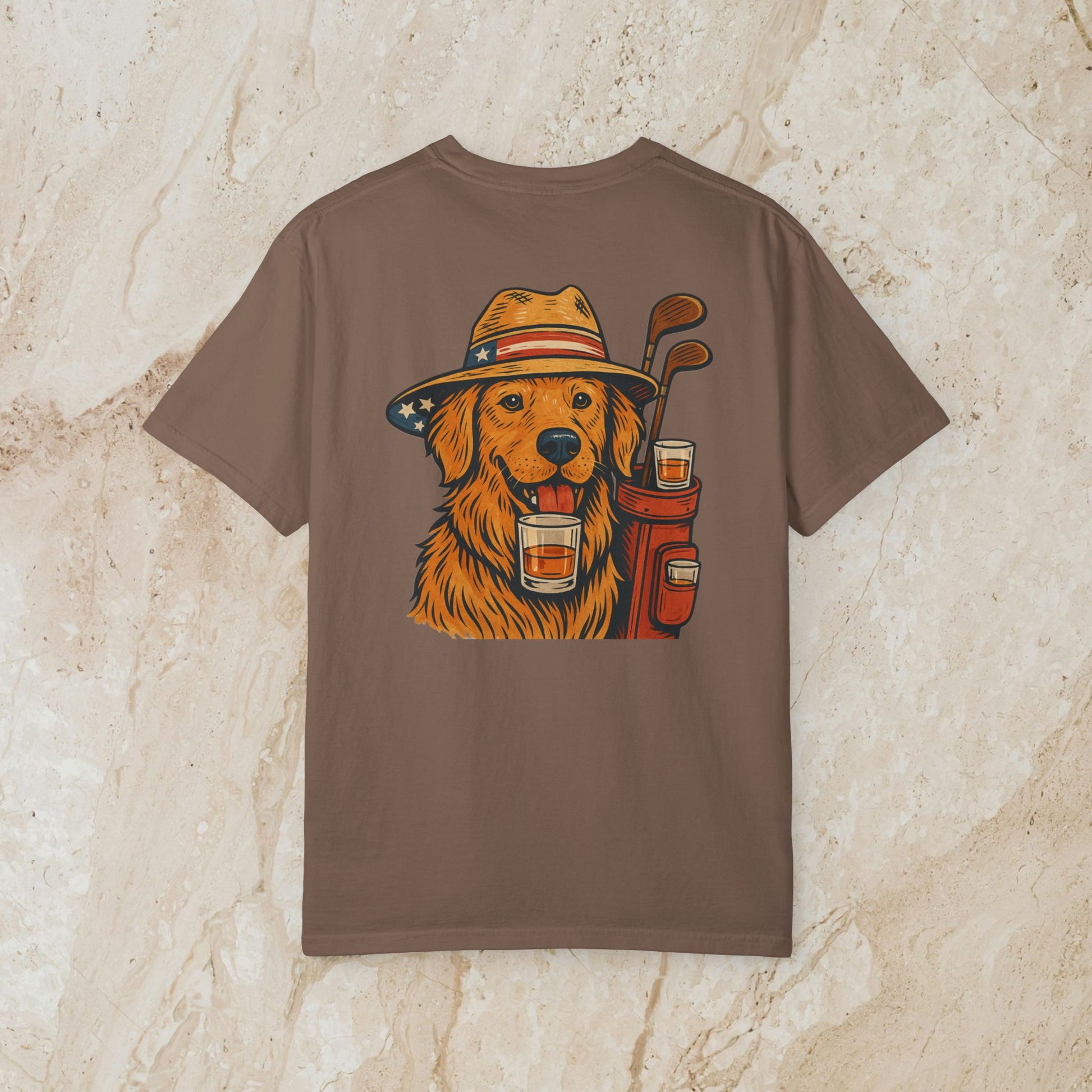 Golden Whiskey Dog Tee in a brown shade, displaying a friendly golden retriever graphic with golf accessories, ideal for casual wear.