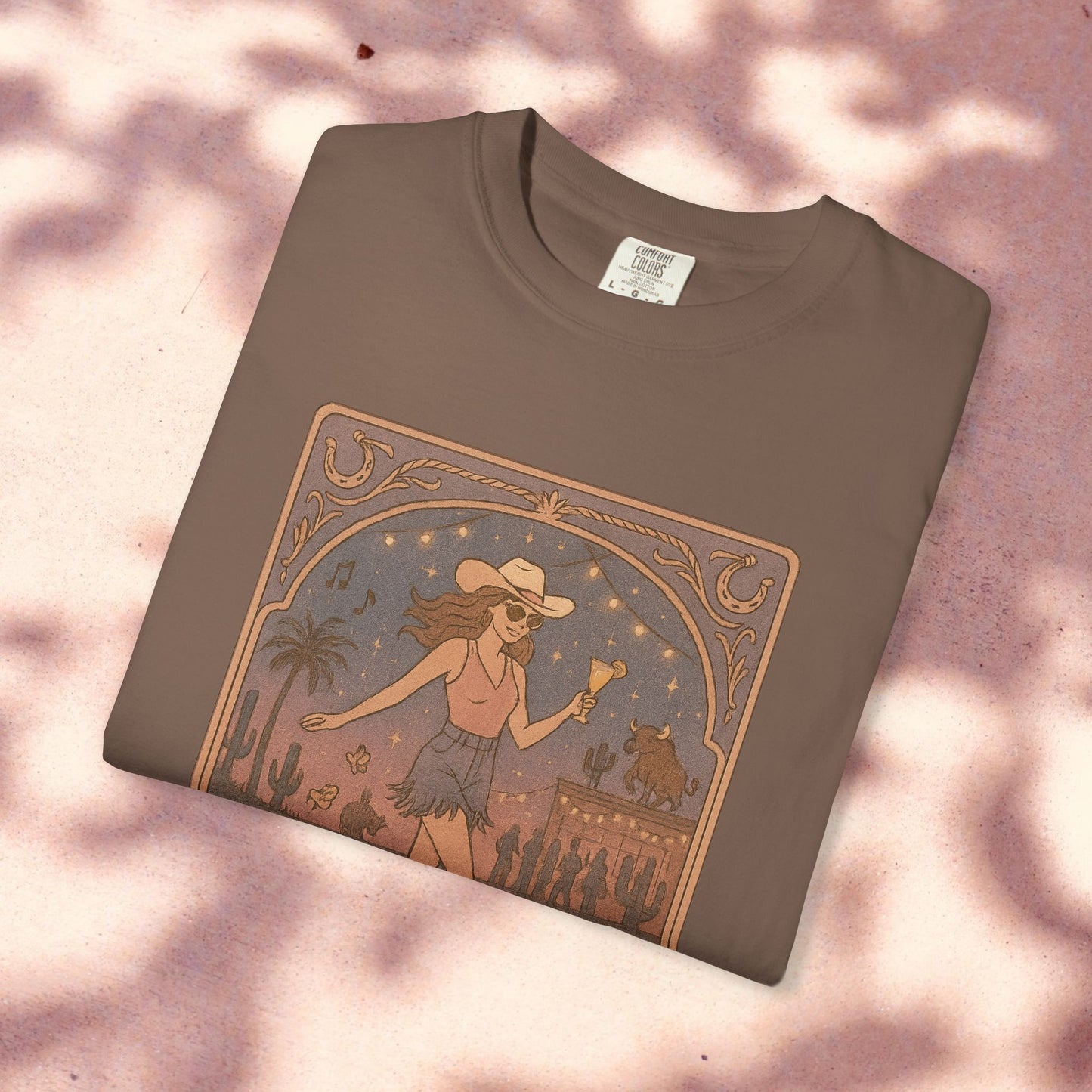 Line Dancer Tarot Tee in earthy brown cotton, showcasing a whimsical illustration of a dancing lady in a cowboy hat, sustainably made and available in sizes S-4XL.