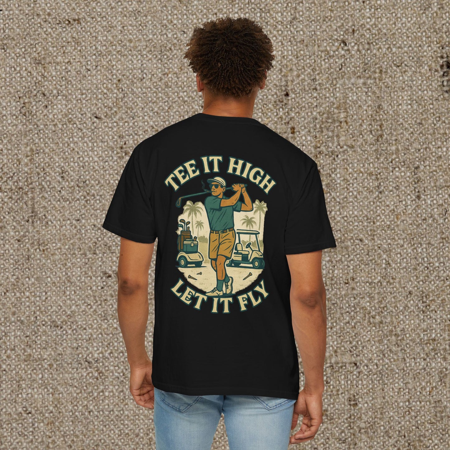 Back view of a man in the Tee It High Let It Fly Graphic Tee, featuring a vibrant golfer graphic, perfect for golf lovers and casual outings.