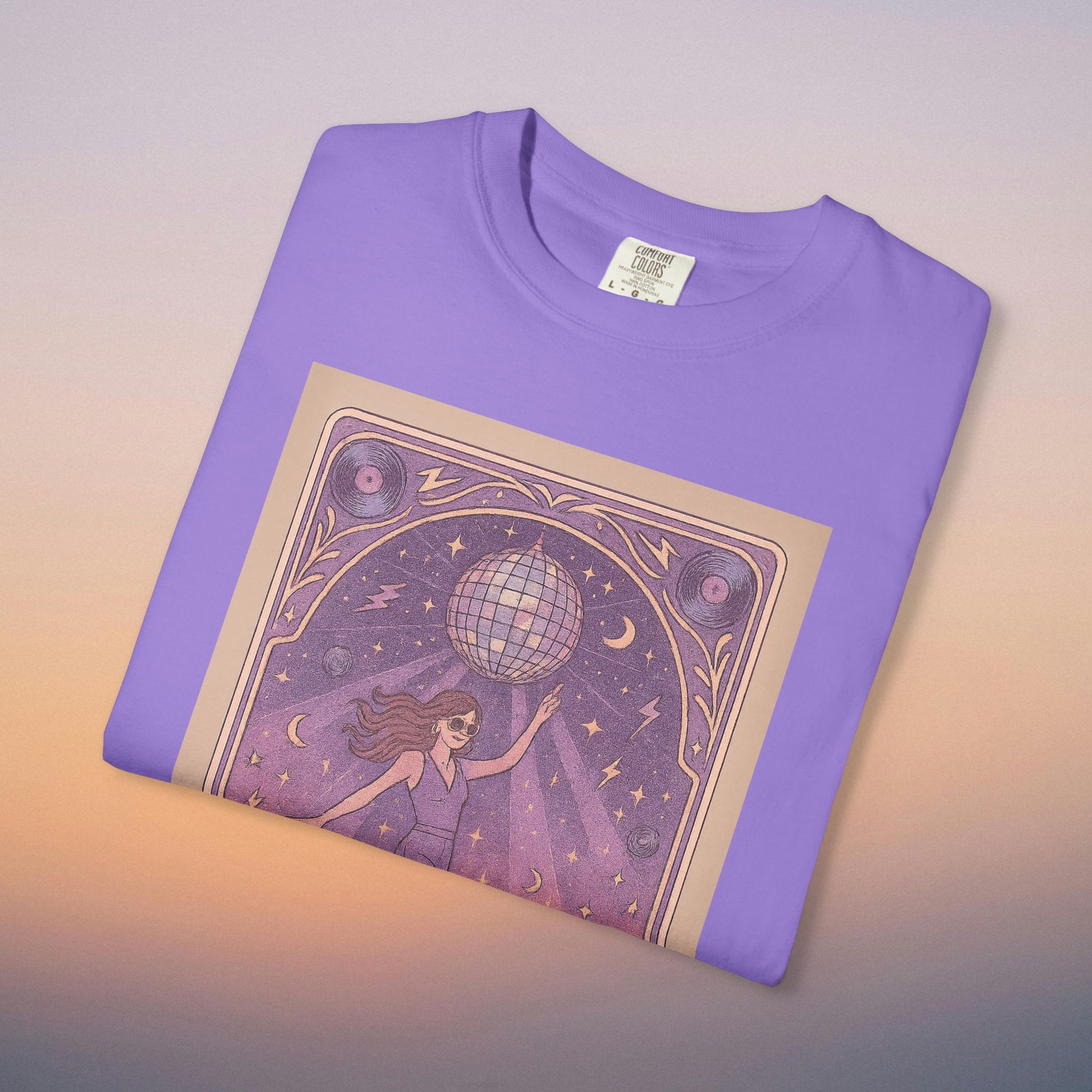 Groove Tarot Graphic Tee in vibrant purple color, constructed from 100% ring-spun cotton, featuring an artistic graphic with a disco ball and celestial motifs, ideal for a stylish look.