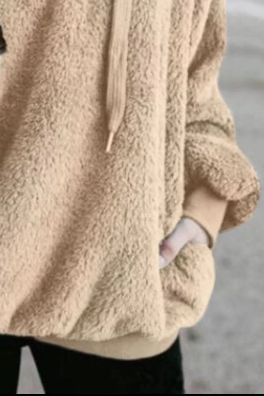 Detail shot of the Cozy Full Size Teddy Hoodie with Quarter-Zip and Drawstring in beige, emphasizing the pocket and soft texture.