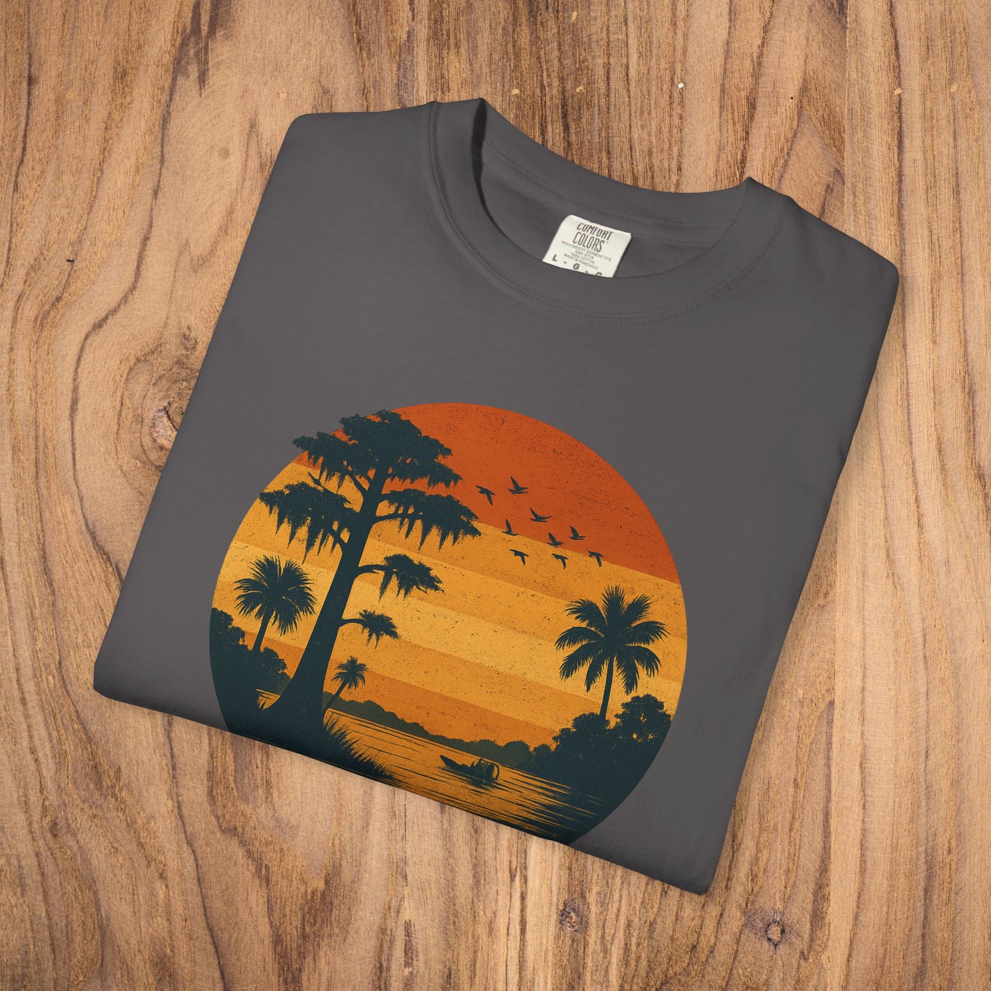Unisex Garment-Dyed Sunset Tee with striking sunset and palm tree graphic, available in S to 4XL, ideal for comfortable and stylish outfits.