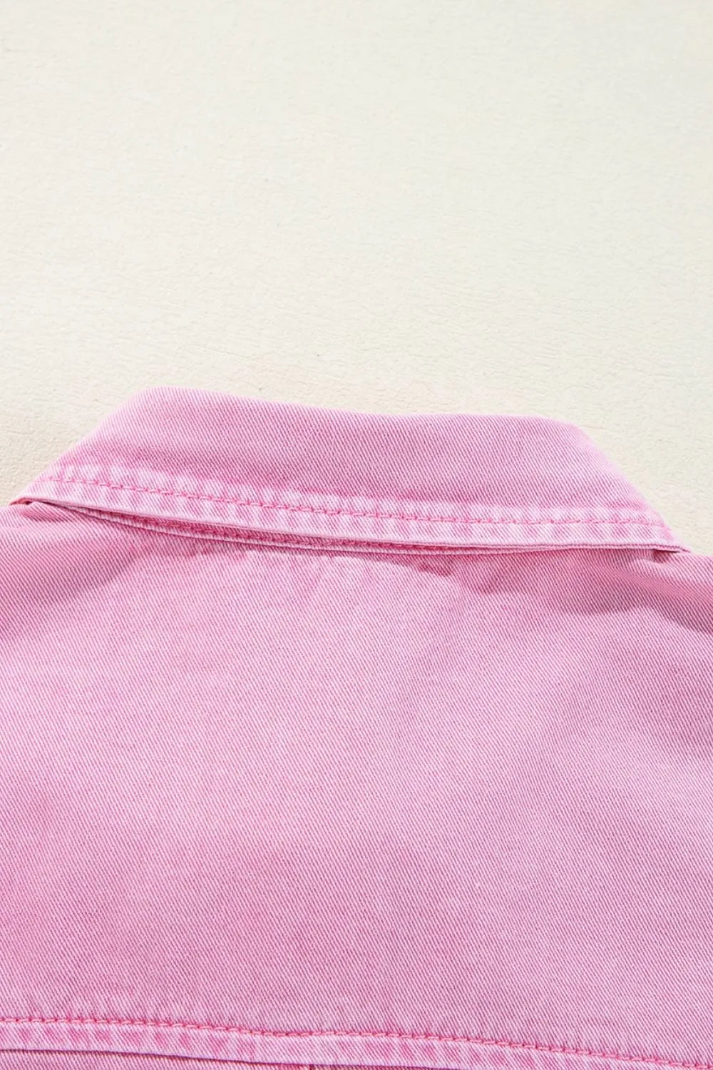Detailed view of the back neckline of a Button Down Short Sleeve Denim Dress with Pockets, emphasizing the clean finish and cotton texture.