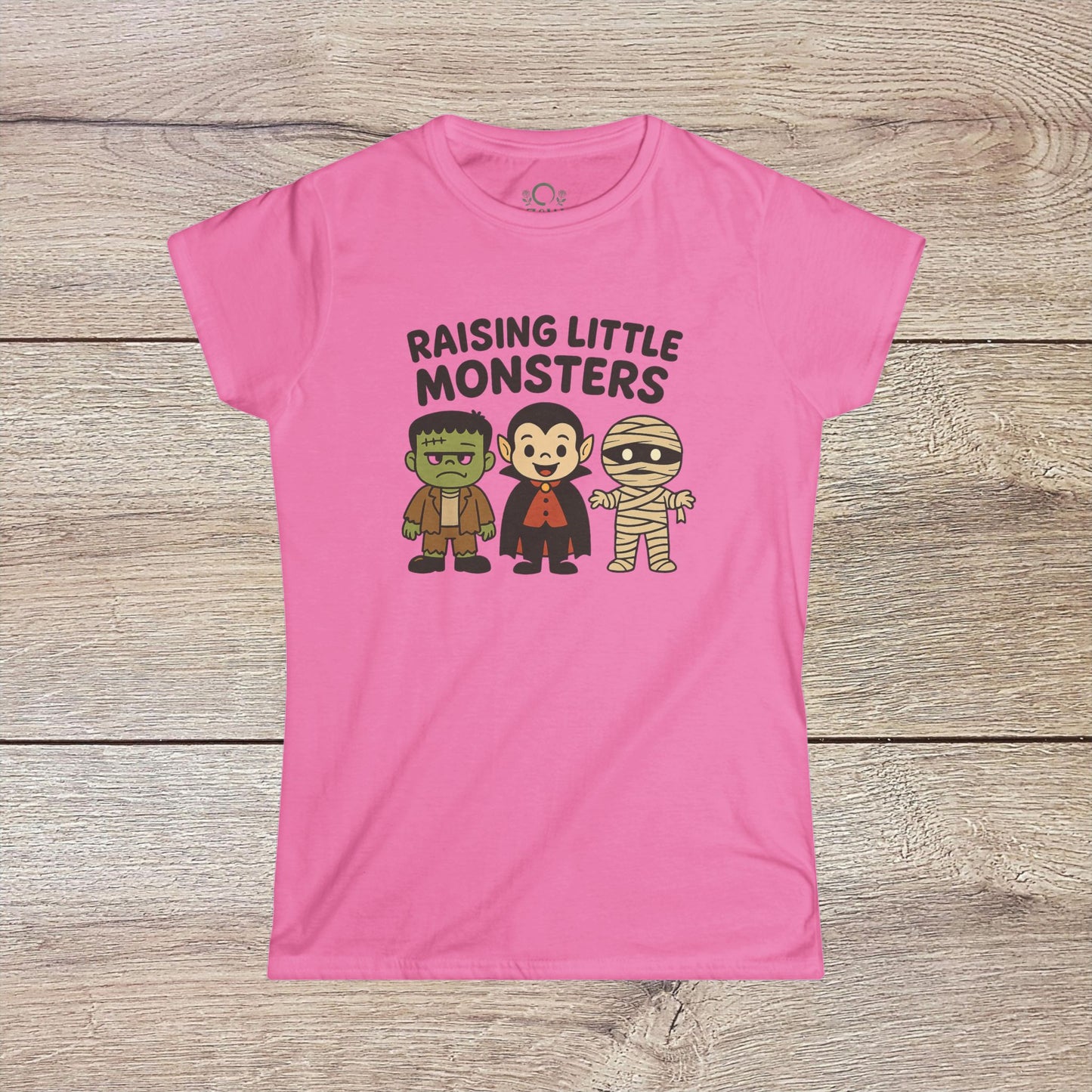 Pink Halloween Family T-Shirt featuring charming designs of Frankenstein, a vampire, and a mummy, perfect for little ones during Halloween - Raising Little Monsters Cute Kids Tee.
