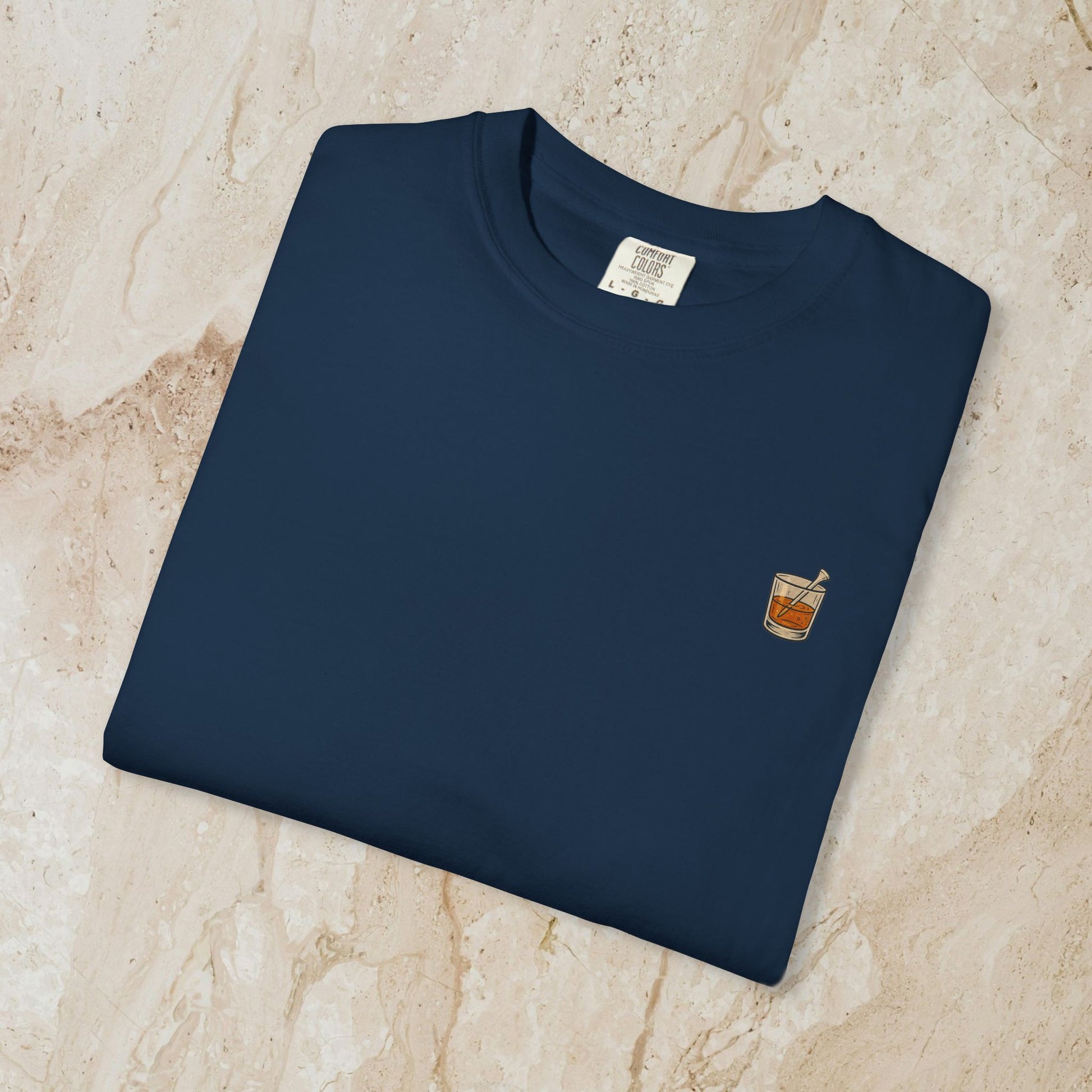 Golden Whiskey Dog Tee featuring a unique vintage style, 100% cotton fabric, relaxed fit, and a stylish left chest pocket, perfectly displayed on a flat surface.