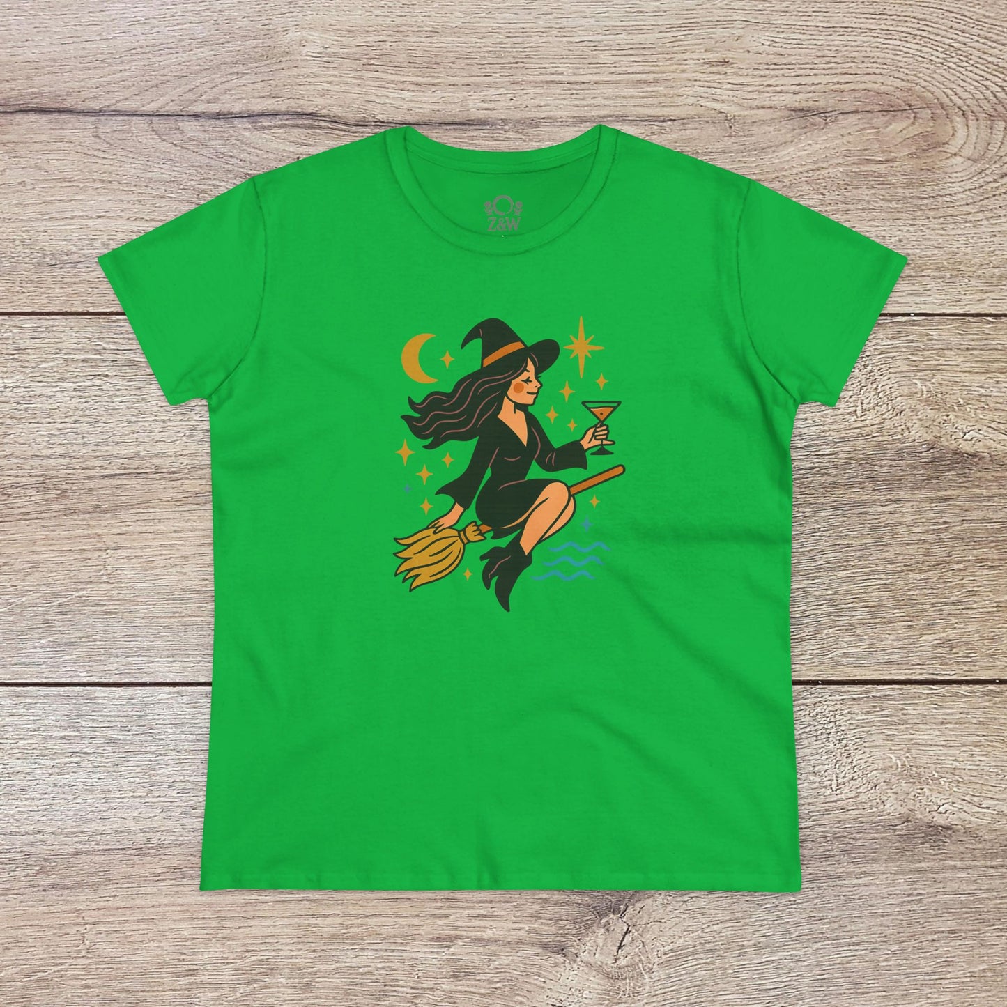 Witchy Night Out Tee featuring a colorful witch flying on a broomstick while holding a cocktail, designed for a stylish and fun look, made from 100% soft cotton, ideal for fashion-forward individuals.