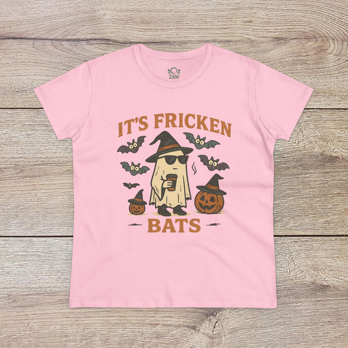 Halloween Unisex T-Shirt in pink showcasing a whimsical ghost design surrounded by bats and pumpkins. Made from 100% cotton, perfect for trick-or-treating.