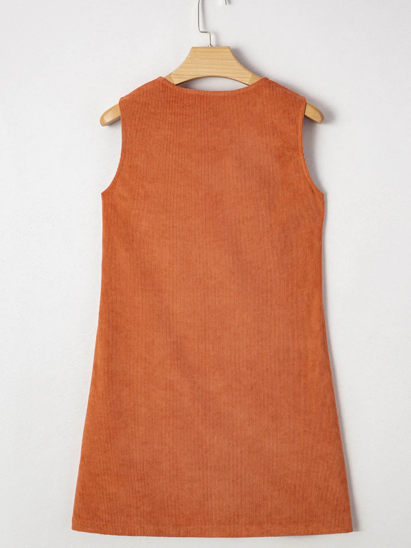Back view of the Corduroy Western Mini Dress With Embroidered Patch Pocket, emphasizing the fabric's quality and sleeveless style.