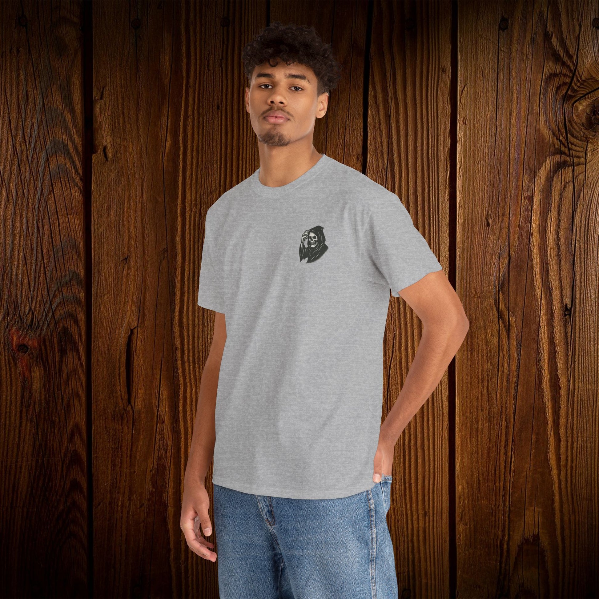 Spooky Halloween Graphic Tee worn by a young man, featuring a spooky ghost print design on the front pocket, ideal for Halloween festivities.