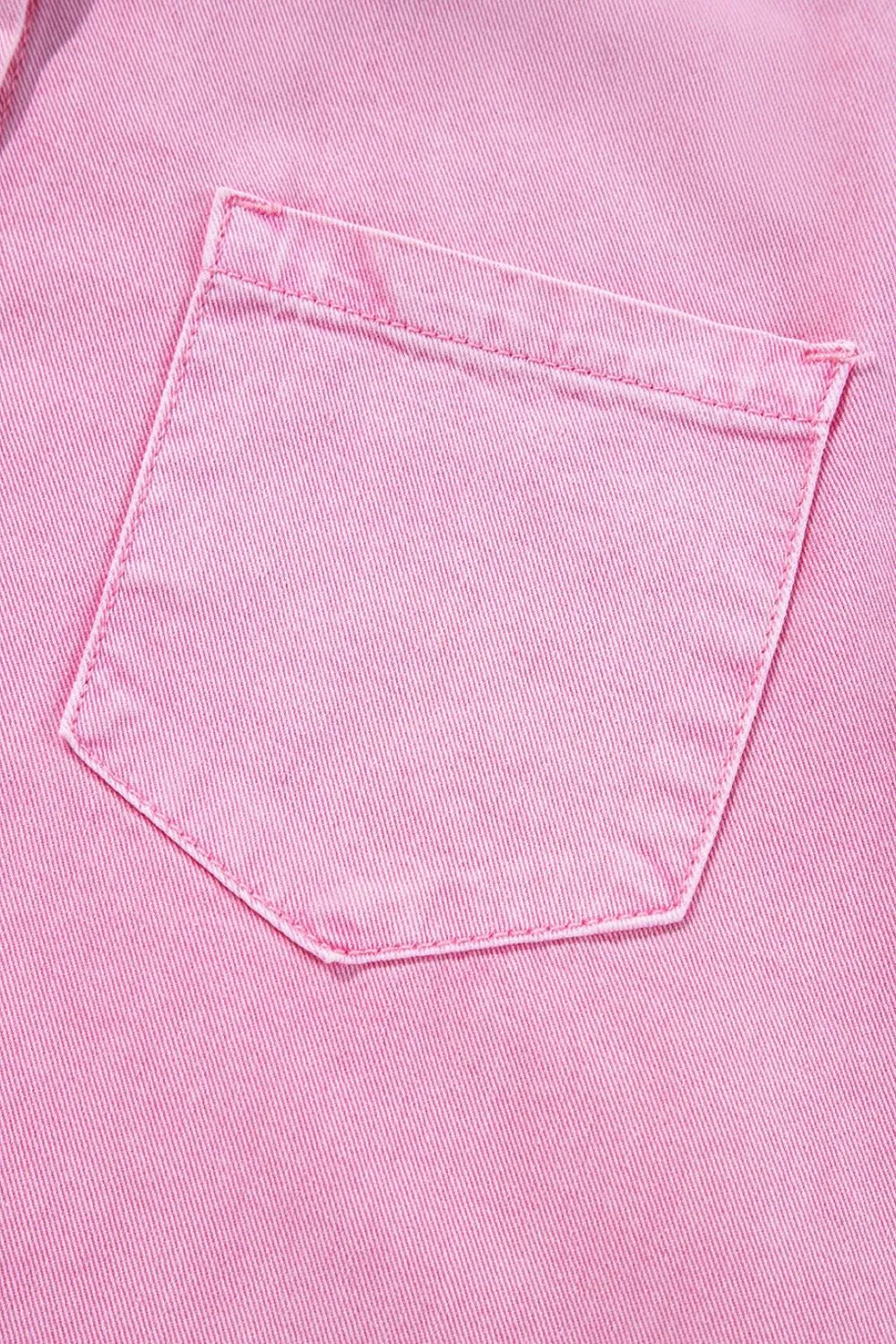 Close-up of the pocket of a Button Down Short Sleeve Denim Dress with Pockets, showcasing the practical design and denim quality.