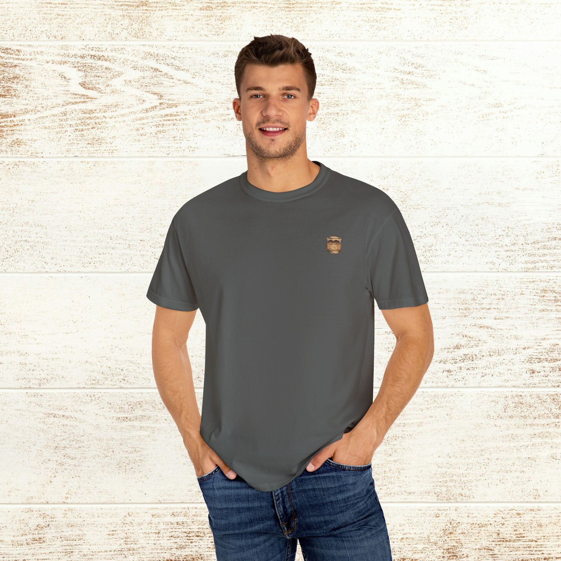 Model showcasing the Rodeo On The Rocks Tee in a dark shade, made of soft 100% US cotton, ideal for a comfortable and fashionable look.