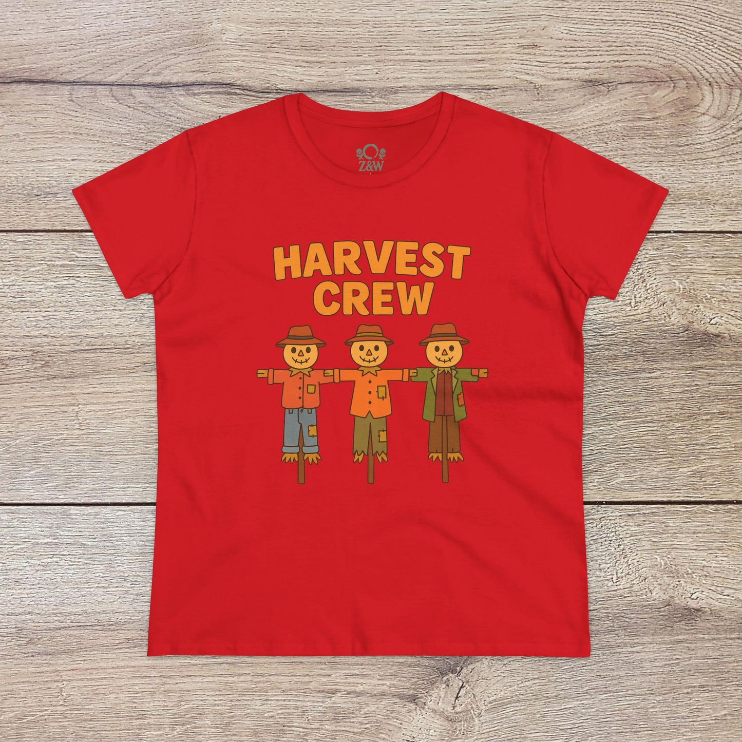 Harvest Crew Halloween T-Shirt in vibrant red with fun scarecrow designs and 'Harvest Crew' text. This tee is made from 100% ring-spun cotton, offering a classic fit that's both cozy and eco-conscious.