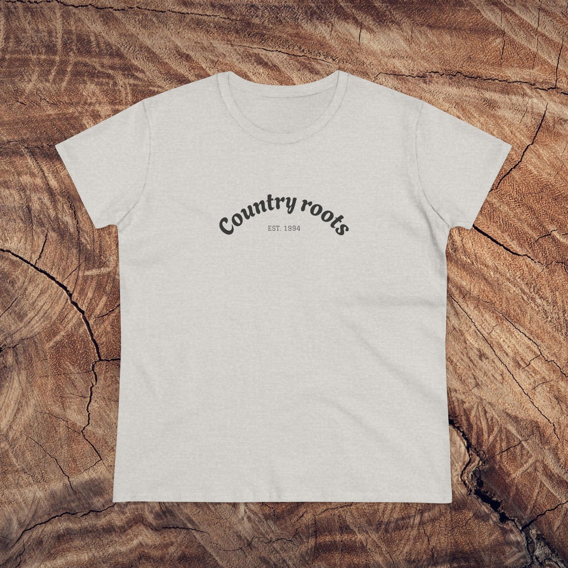 Classic heather grey Country Roots Cowgirl Tee on a wooden texture background, featuring 'Country roots EST 1984'. A perfect blend of comfort and style for daily wear.
