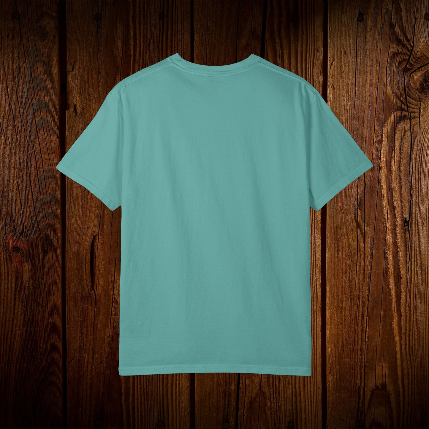 Back view of the Unisex Swamp-Bred Fairway-Fed Tee in turquoise color, showcasing its classic design and comfortable fit.