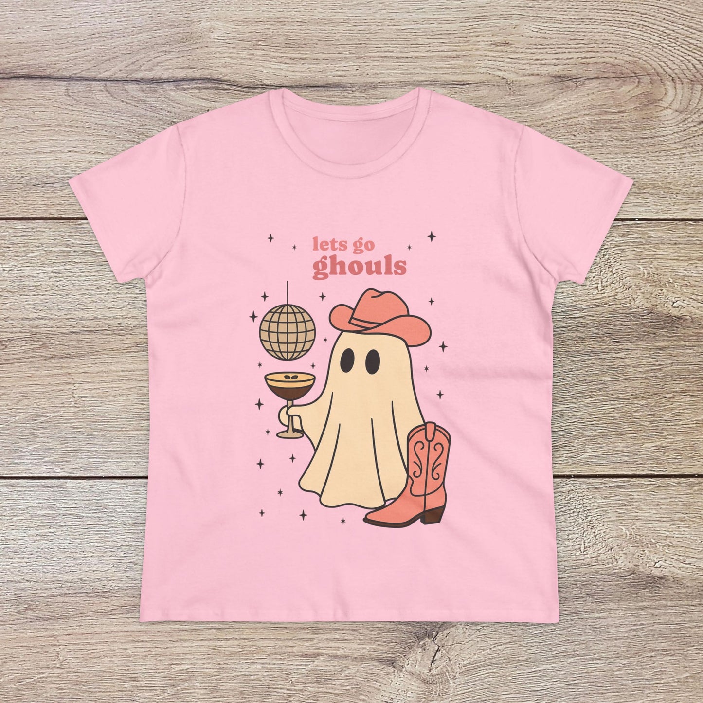 Let's Go Ghouls Tee in soft pink with a cute ghost in cowboy gear, ideal for Halloween fun and everyday wear. Crafted from 100% cotton for added comfort.