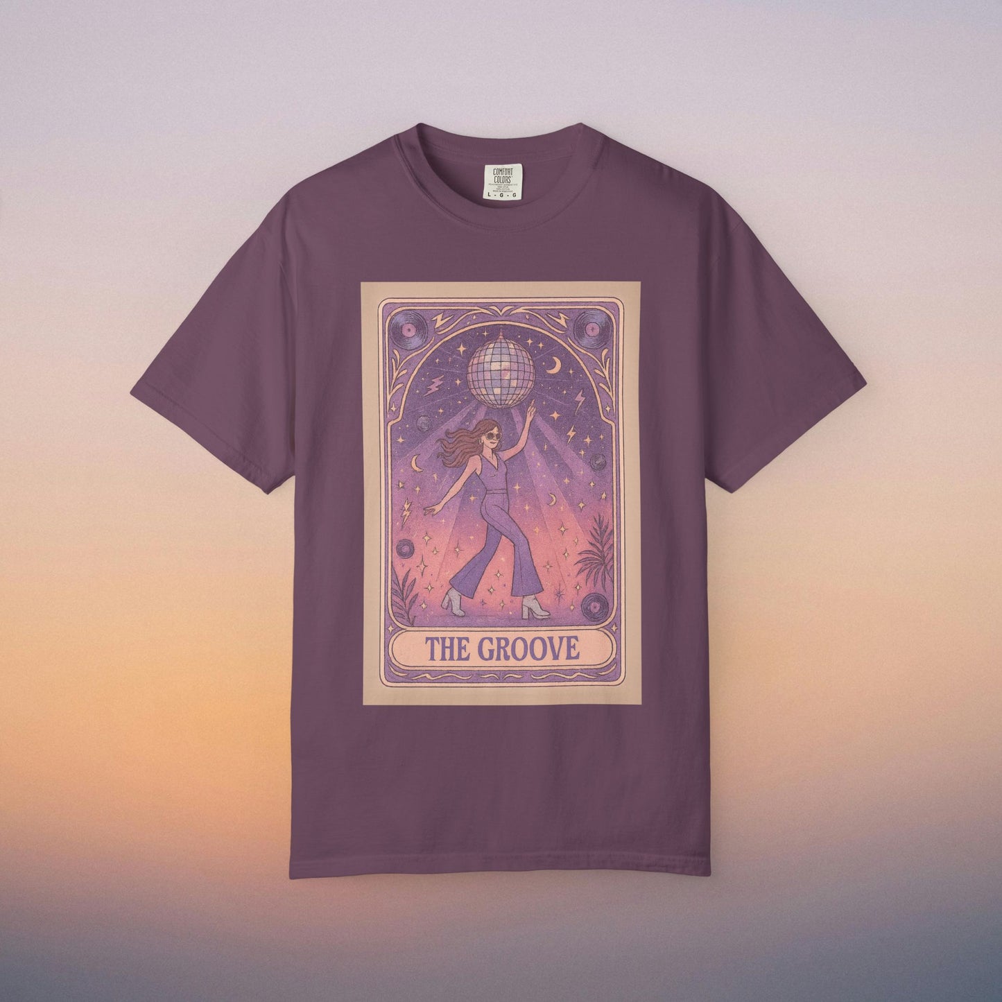 Groove Tarot Graphic Tee in deep plum, featuring a creative design showing a character under a disco ball, constructed from breathable 100% ring-spun cotton, suitable for everyone.