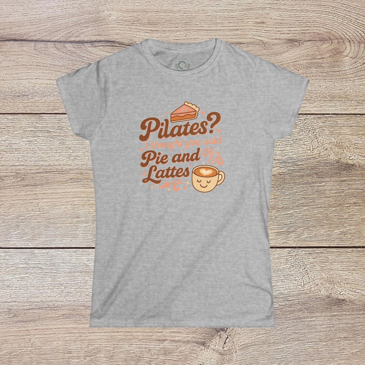 Funny Pilates T-Shirt with Durable Shoulder Tape presenting fun phrase 'Pilates? I thought you said Pie and Lattes' on a grey background. Perfect for daily comfort.